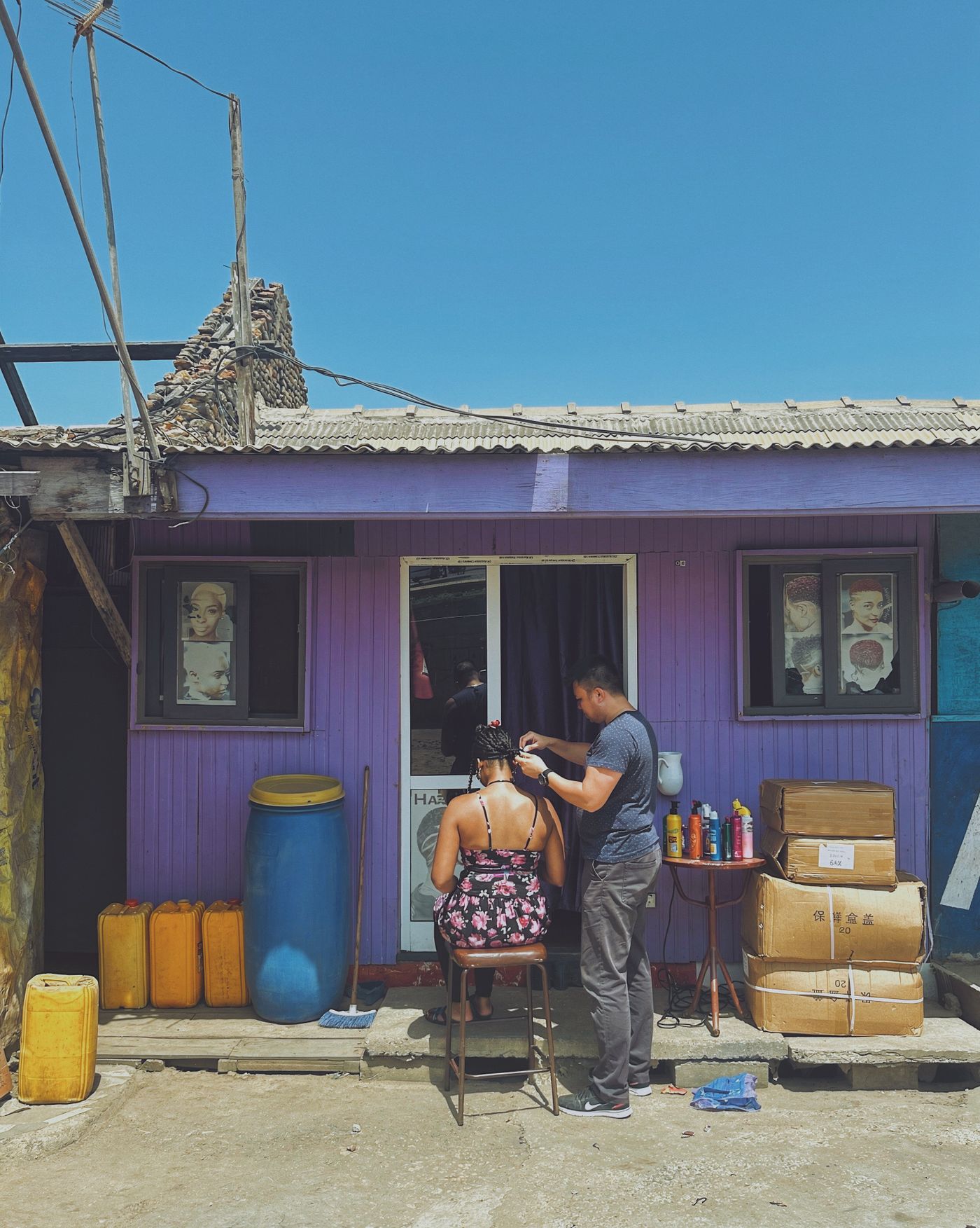 Braider at work — outdoor salon